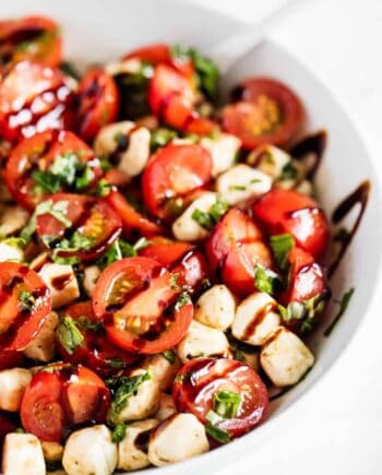 tomato basil mozzarella salad in white bowl
