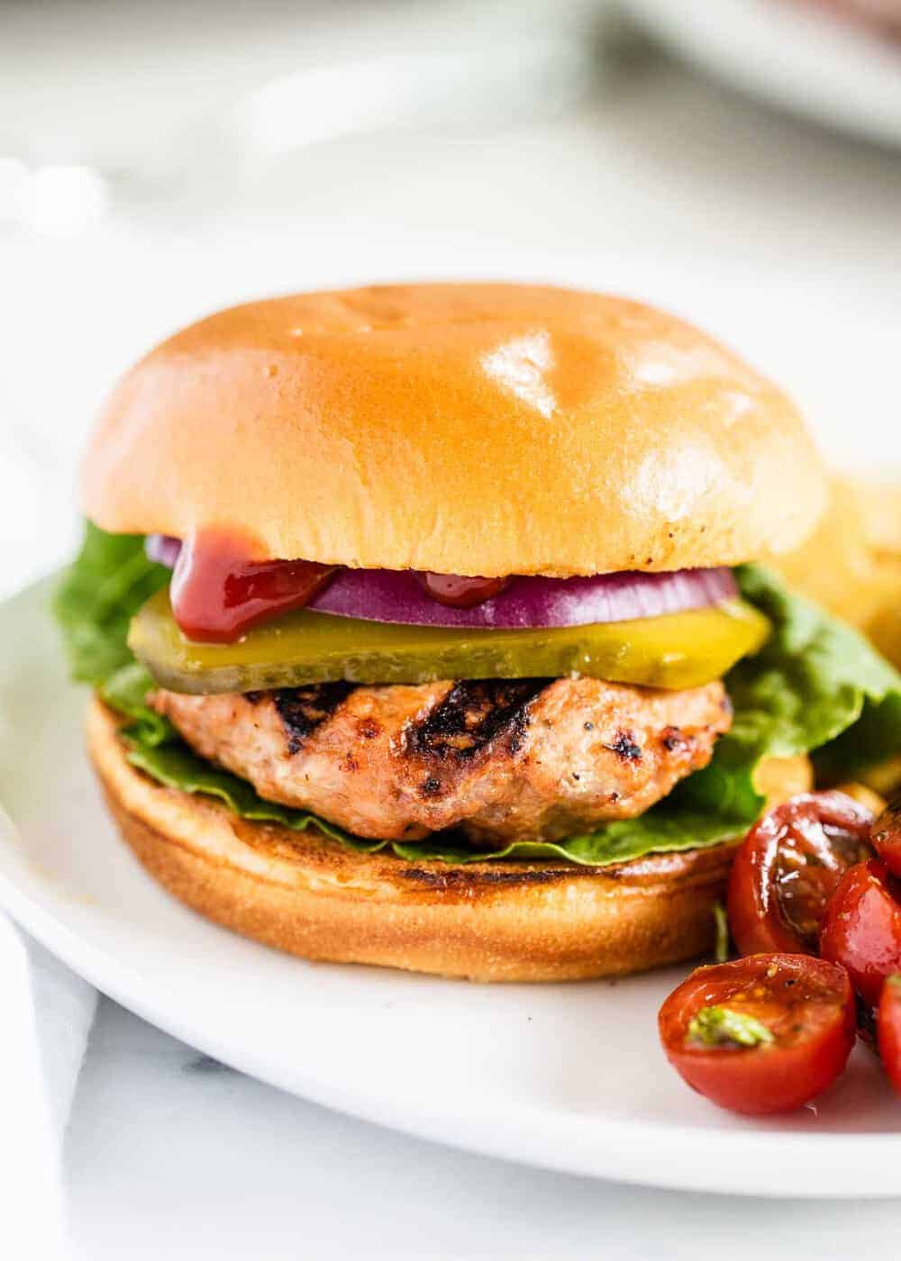 Turkey burger on a white plate.