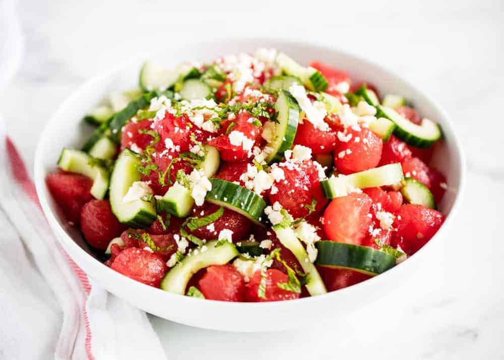 Watermelon feta mint salad in a white bowl.