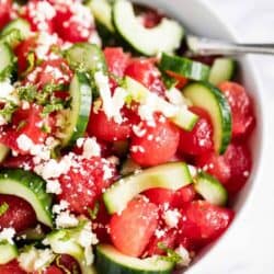 watermelon salad with cucumber in white bowl