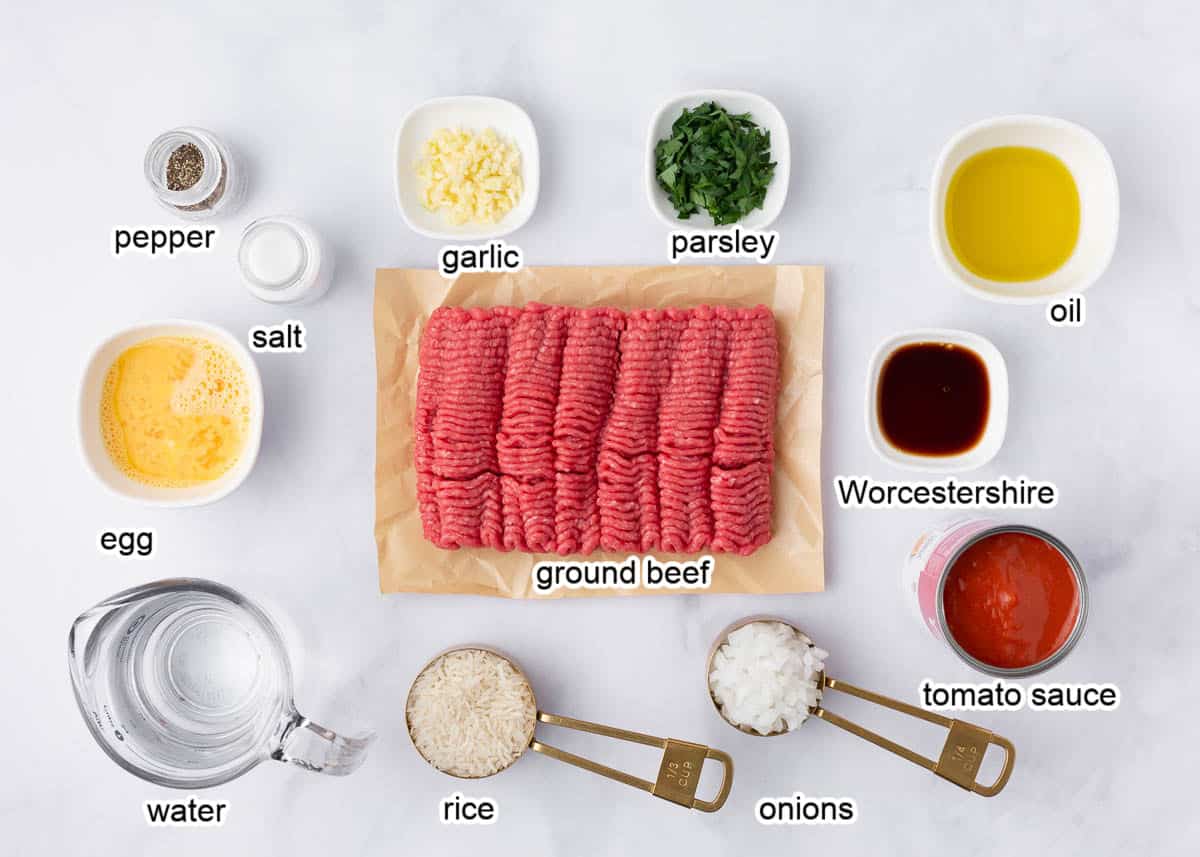 Porcupine meatball ingredients on a marble countertop. 