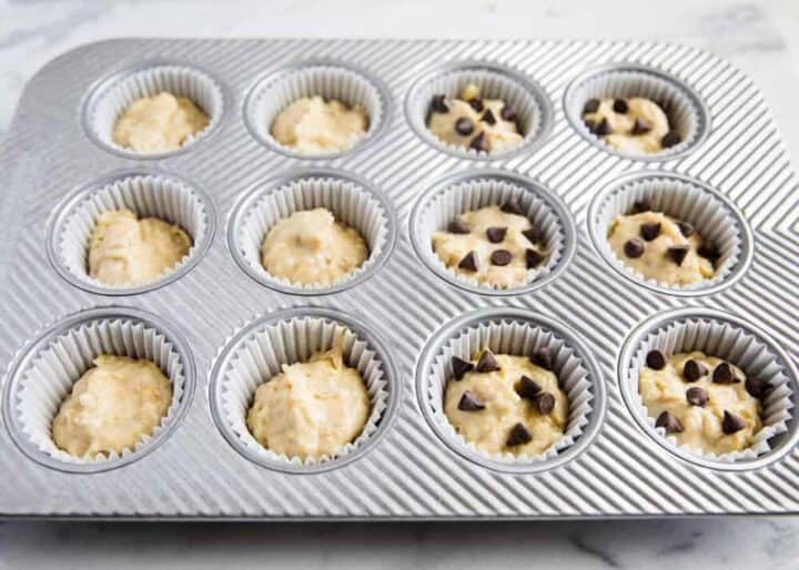 muffin tin filled with banana bread muffin batter 