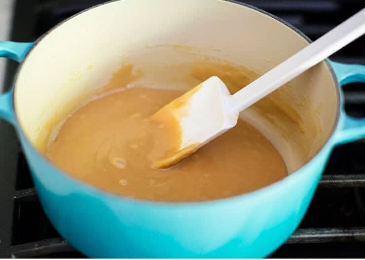 Making caramel for carmelitas in a pan on the stove.