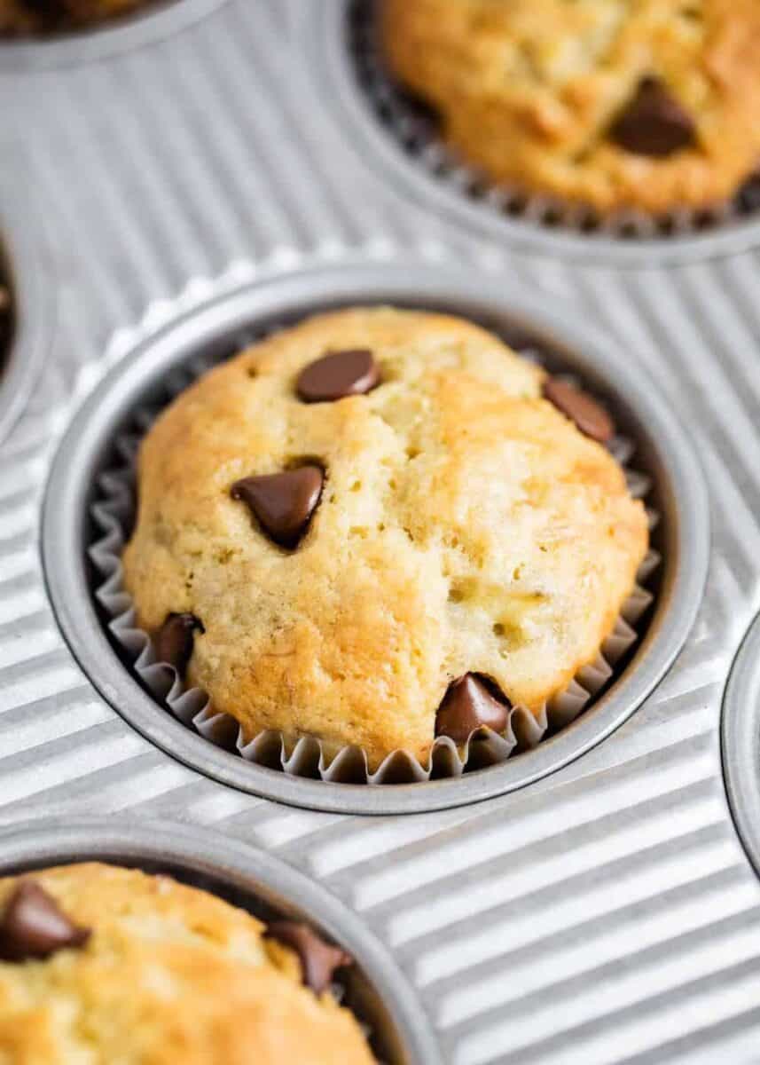 close up of chocolate chip banana bread muffins in pan 