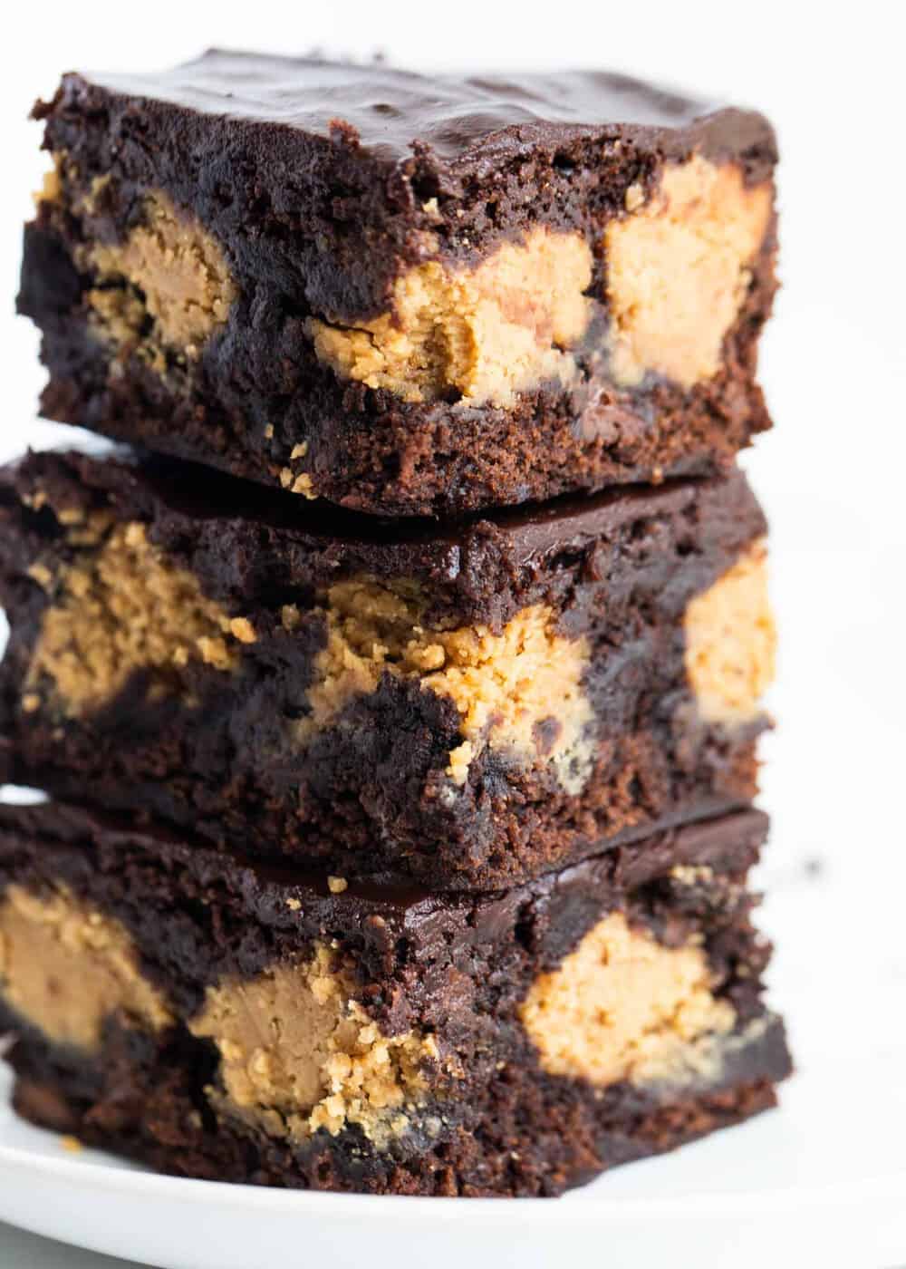Stack of chocolate peanut butter brownies.