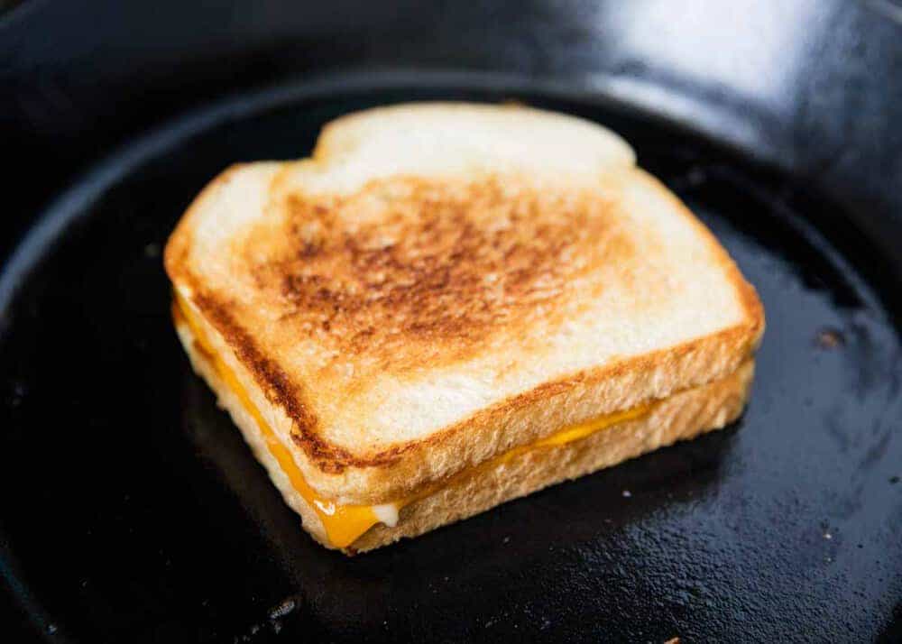 Frying a grilled cheese sandwich on the skillet.