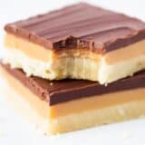 stack of twix bars with a bite taken out