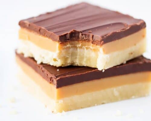 stack of twix bars with a bite taken out