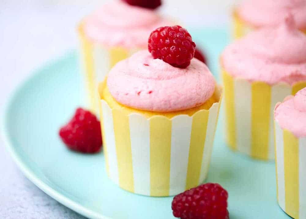 lemon cupcakes with raspberry frosting on top