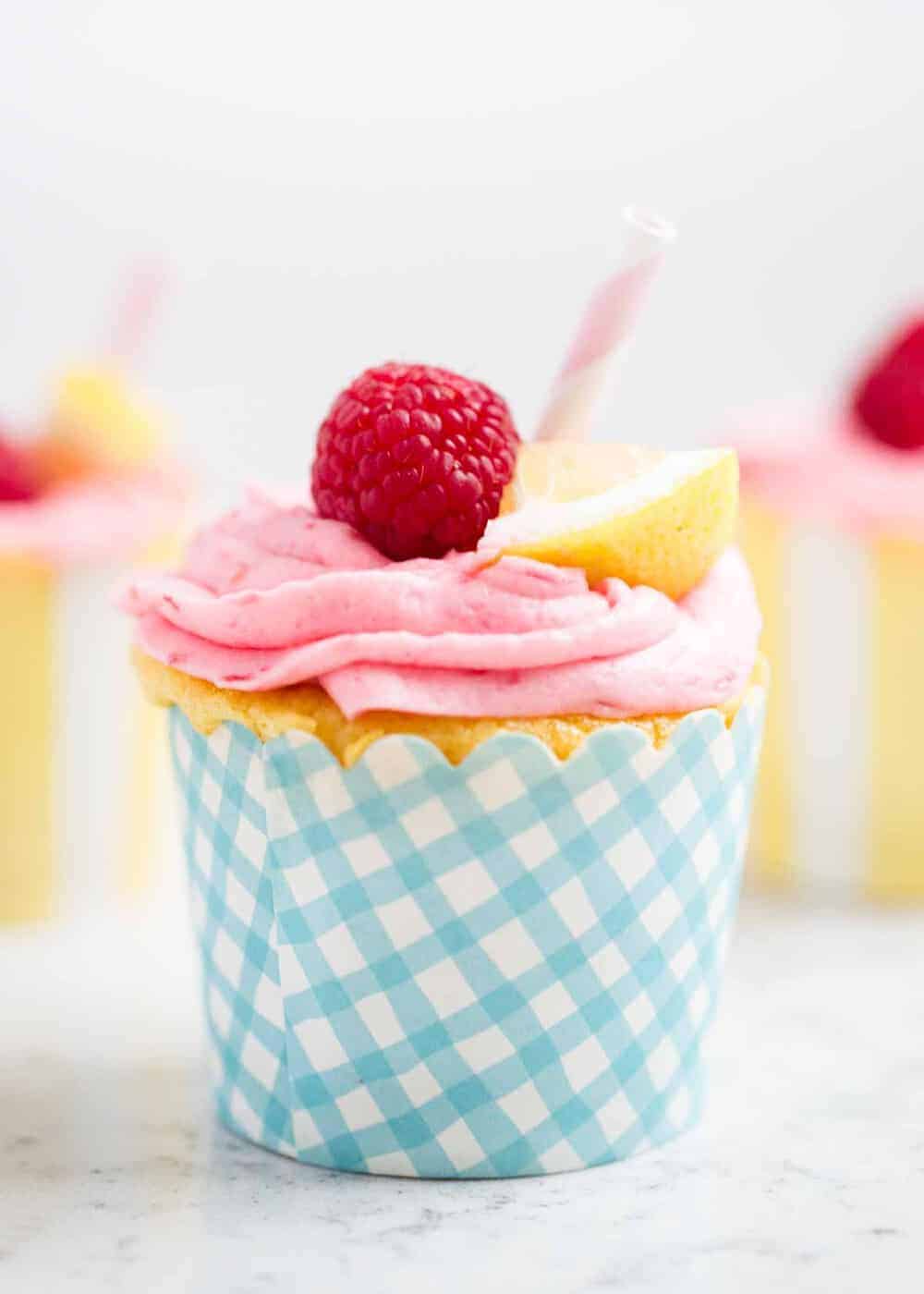 lemon raspberry cupcakes in a blue cupcake liner