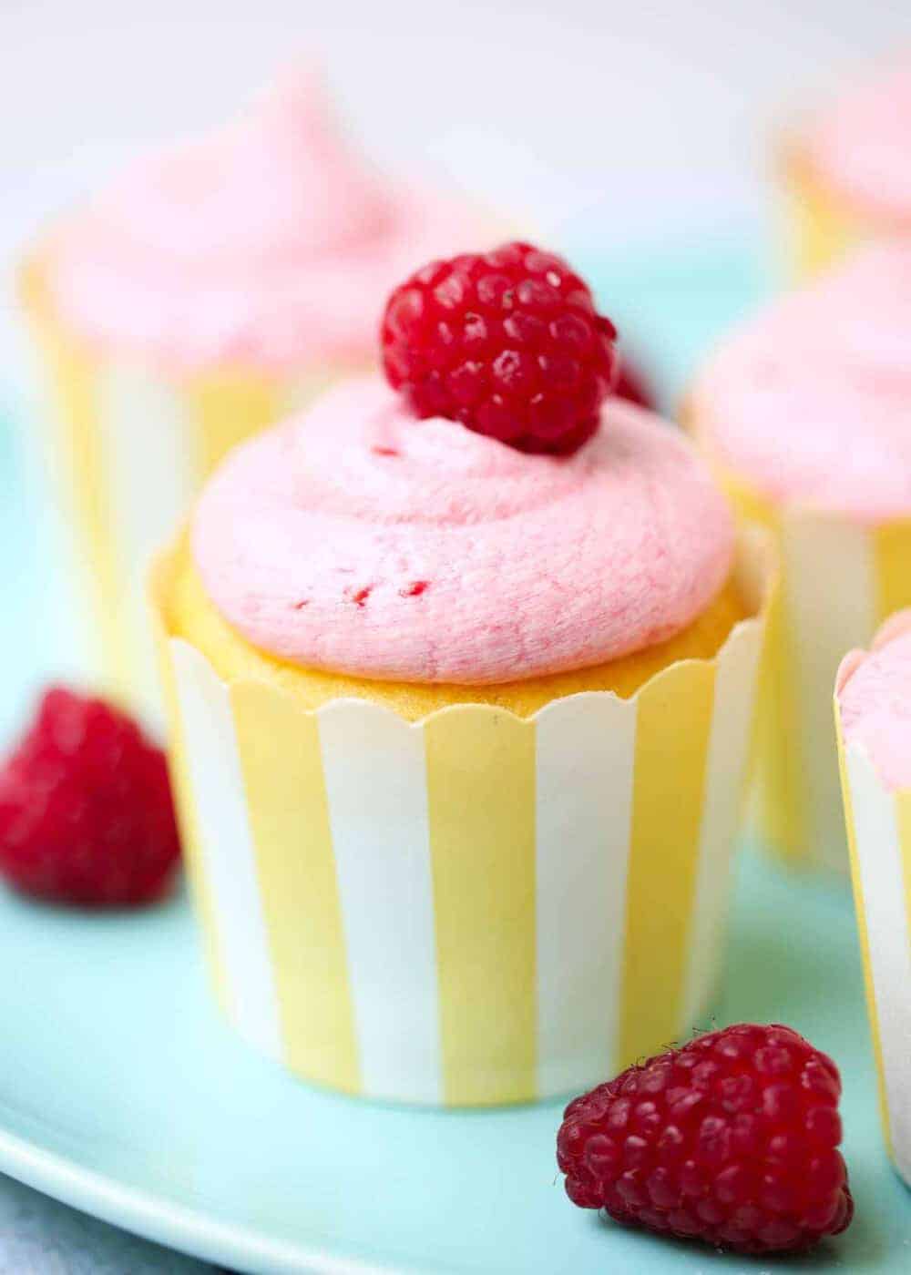 lemon raspberry cupcakes on a blue plate