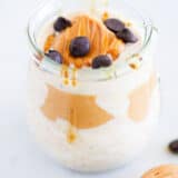 Peanut butter overnight oats in a jar with chocolate chips on top.