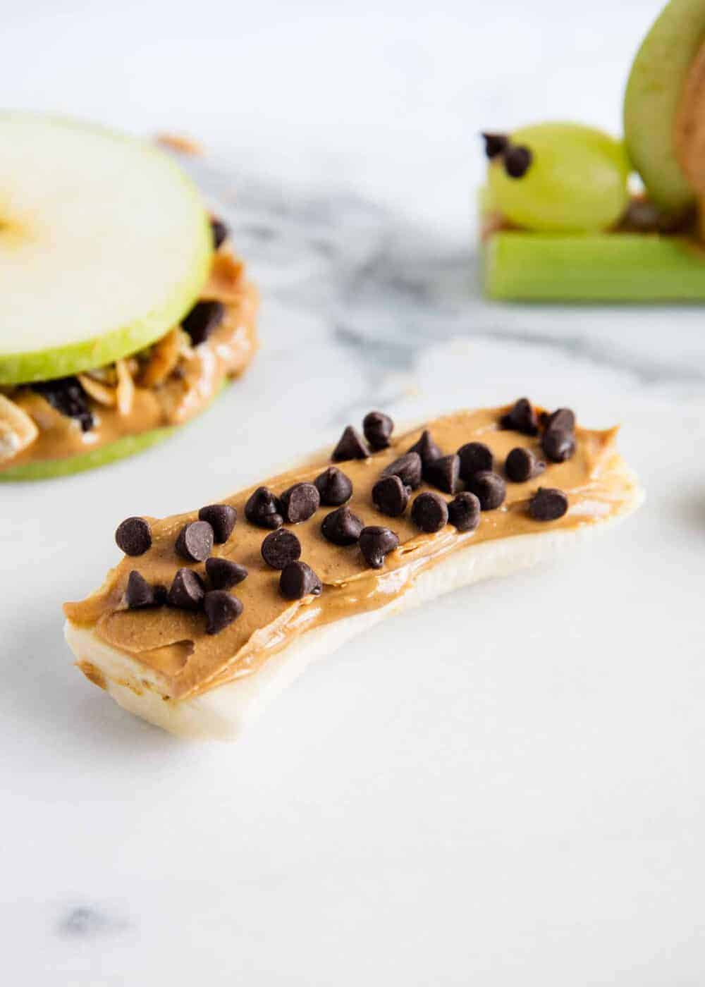 banana peanut butter ants on a log with chocolate chips 