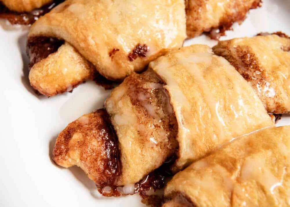 Close up of a cinnamon crescent roll.