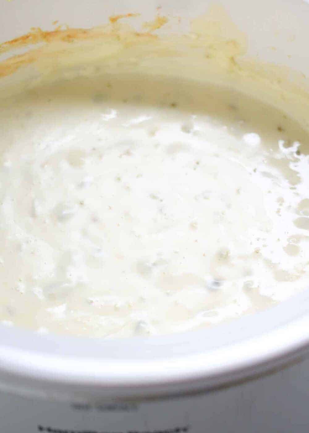 Queso blanco dip in a slow cooker. 
