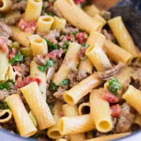 rigatoni noodles with bolognese sauce in pan