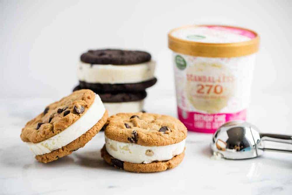 ice cream sandwiches on the counter with a pint of ice cream 