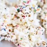 a close up of cake batter popcorn with sprinkles