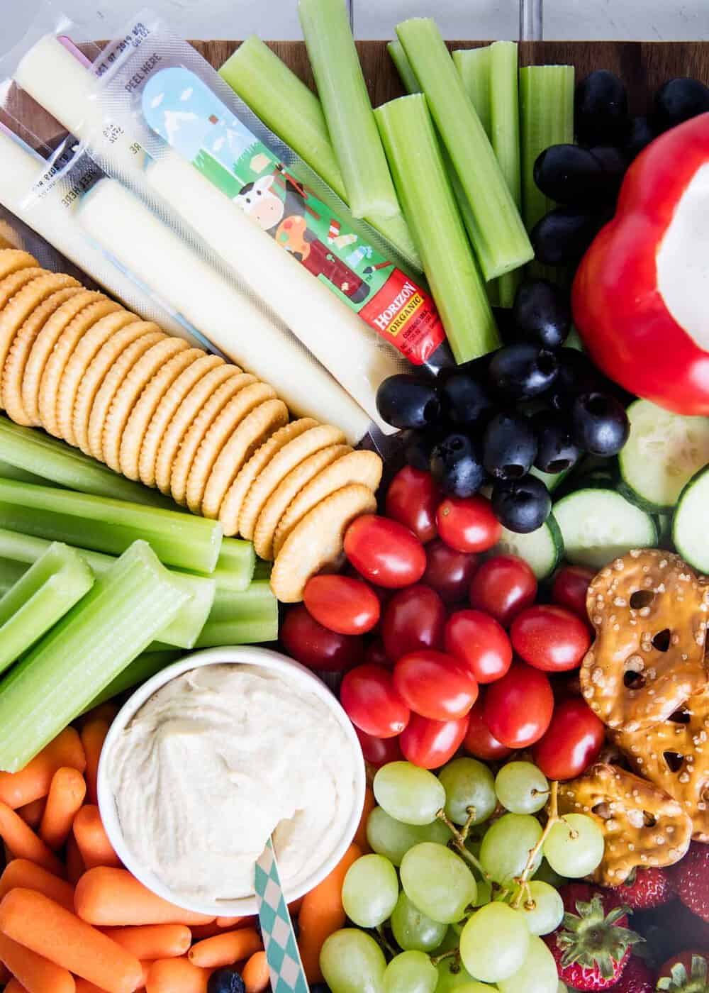 Vegetable platter with crackers and cheese.