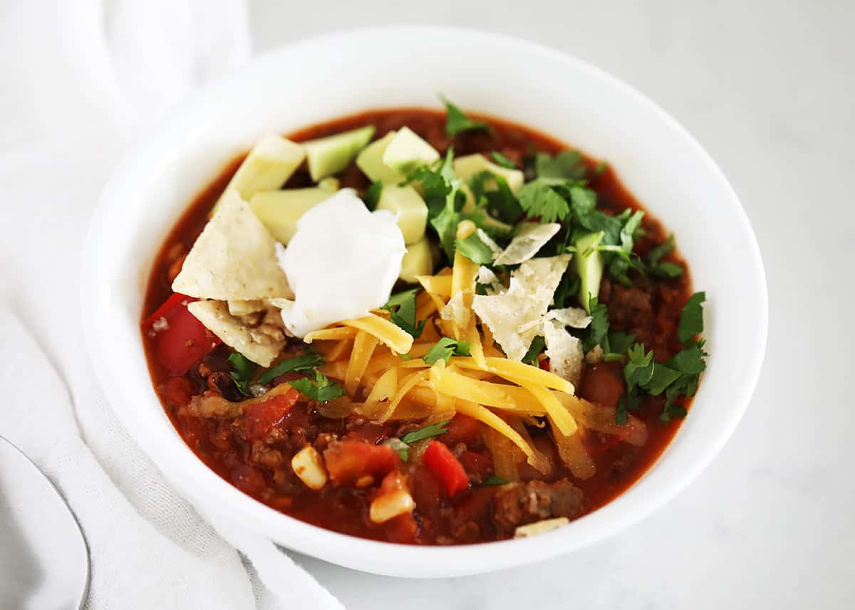 Taco soup in a white bowl. 