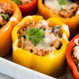 chicken stuffed peppers in a baking dish