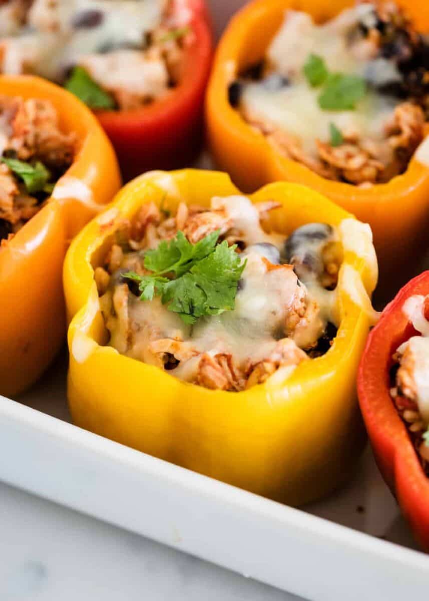 chicken stuffed bell pepper topped with cheese and cilantro 