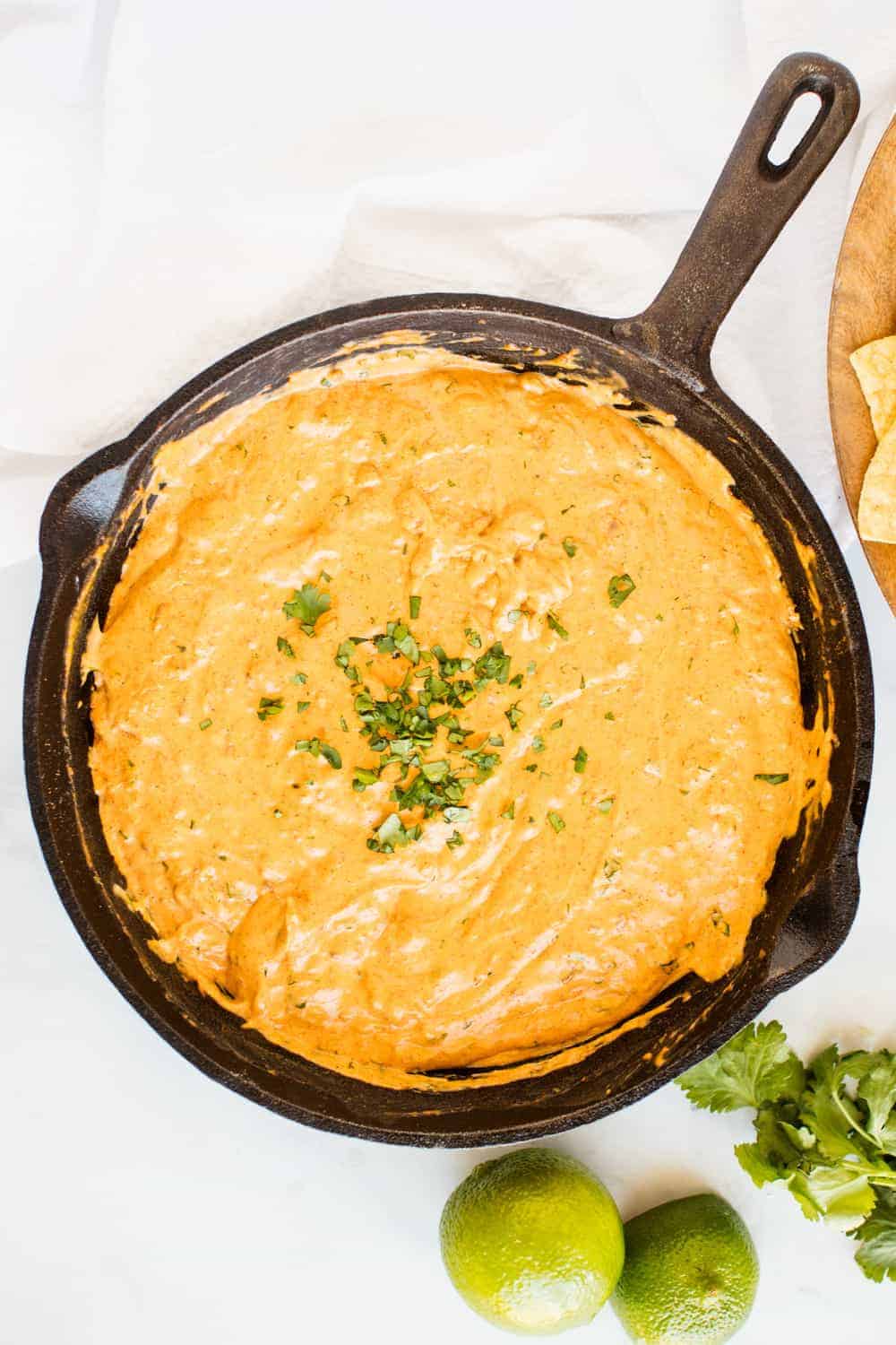 Chili cream cheese dip in a cast iron skillet.