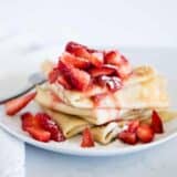 strawberry crepes on a white plate