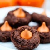 pumpkin chocolate cake mix cookies with a pumpkin Hershey kiss in the middle