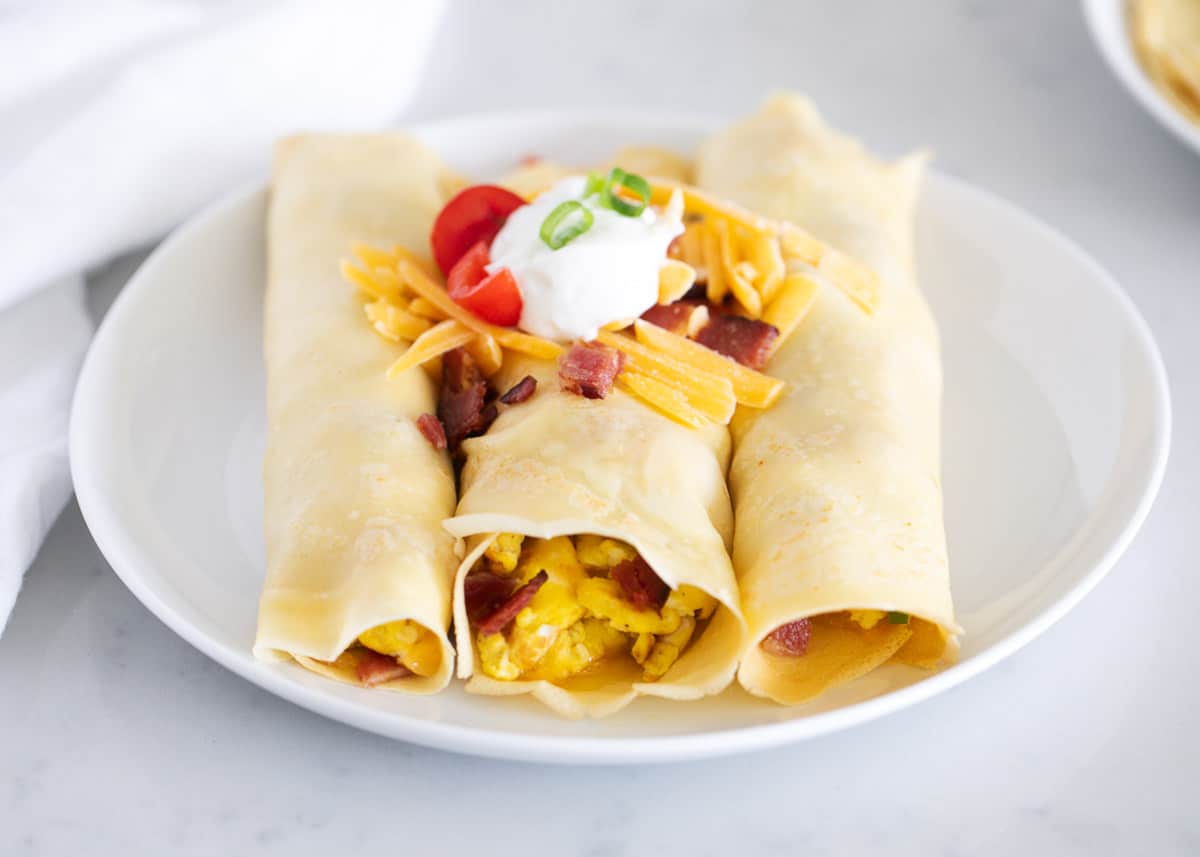 Savory crepes on a white plate. 