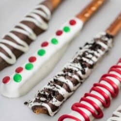 chocolate covered pretzel rods with toppings