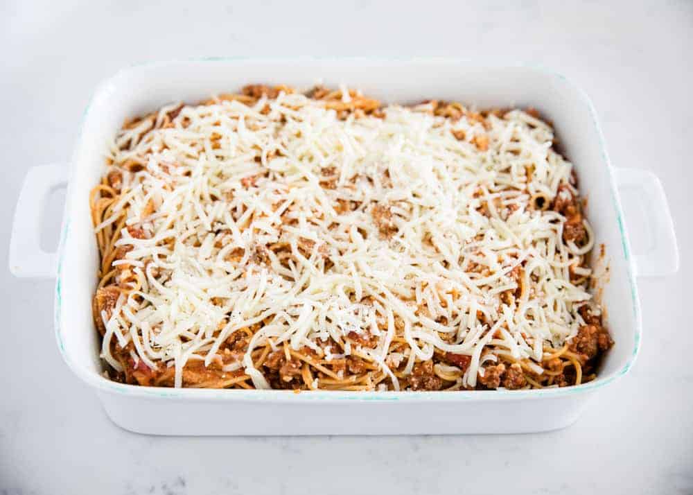 Baked spaghetti with mozzarella cheese on top.