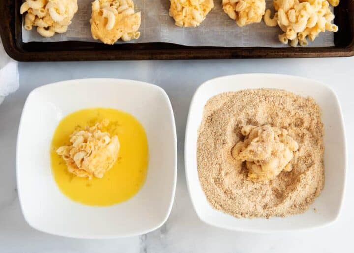 coating mac and cheese balls in egg wash and breadcrumb mixture 