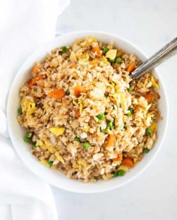 fried rice in white bowl with spoon