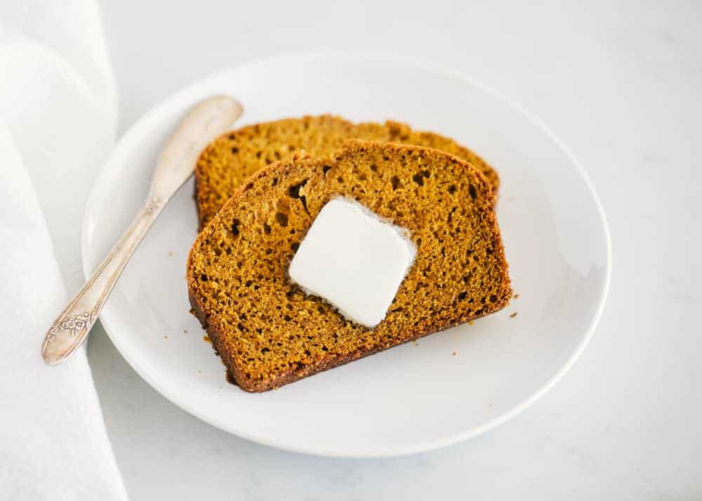 Pumpkin bread with butter.