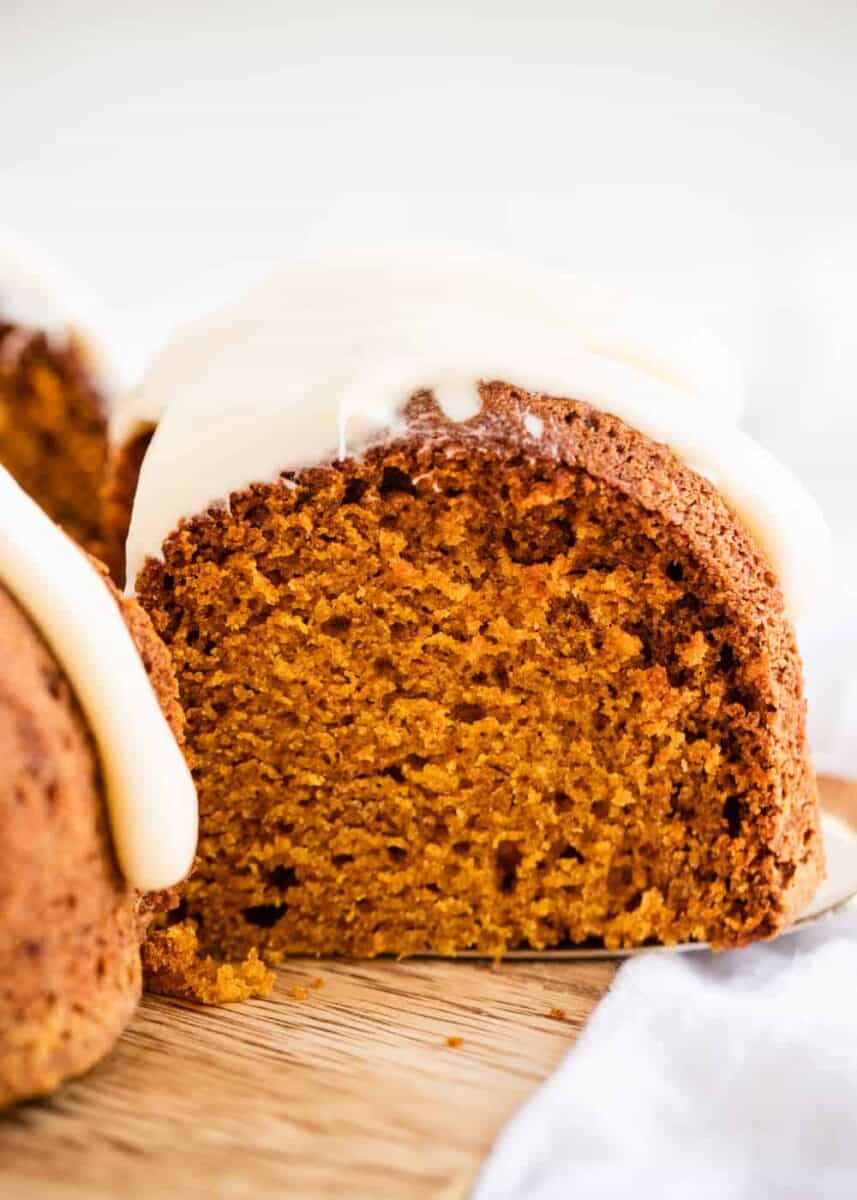 piece of pumpkin spice bundt cake with cream cheese frosting 