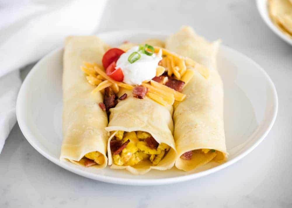 savory crepes with cheese on white plate