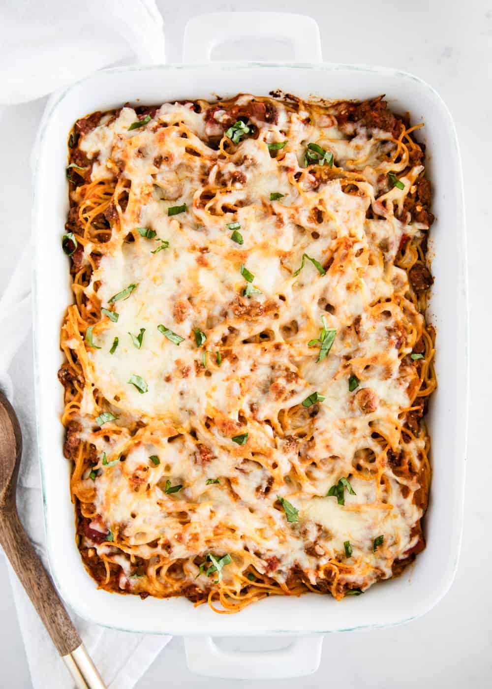 Spaghetti casserole in white dish.