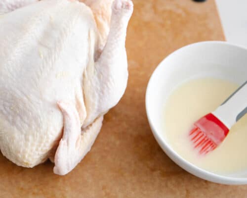 chicken and butter on cutting board