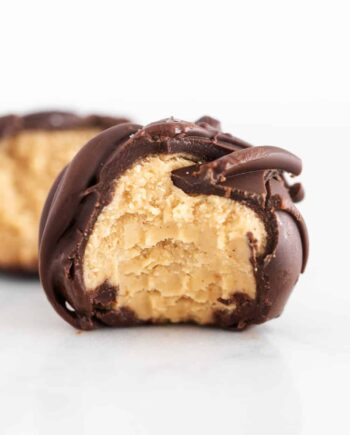 chocolate peanut butter ball with a bite taken