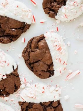 Chocolate cookies dipped in white chocolate and sprinkled with crushed candy canes.