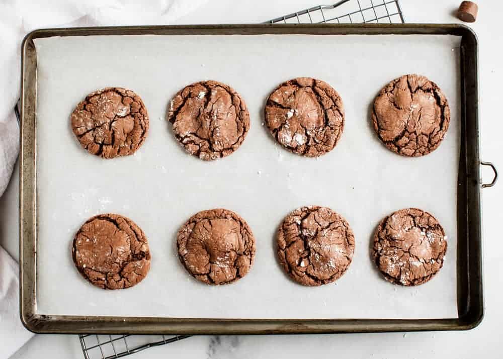 Baked Rolo candy cookies on a baking sheet.