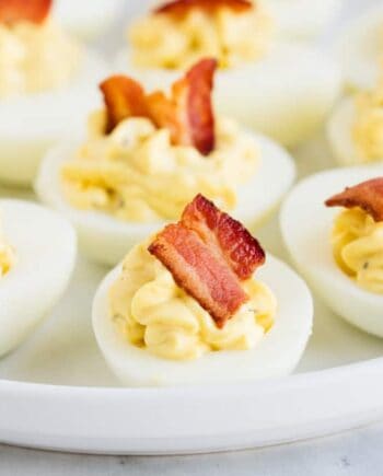 bacon ranch deviled eggs on a white plate