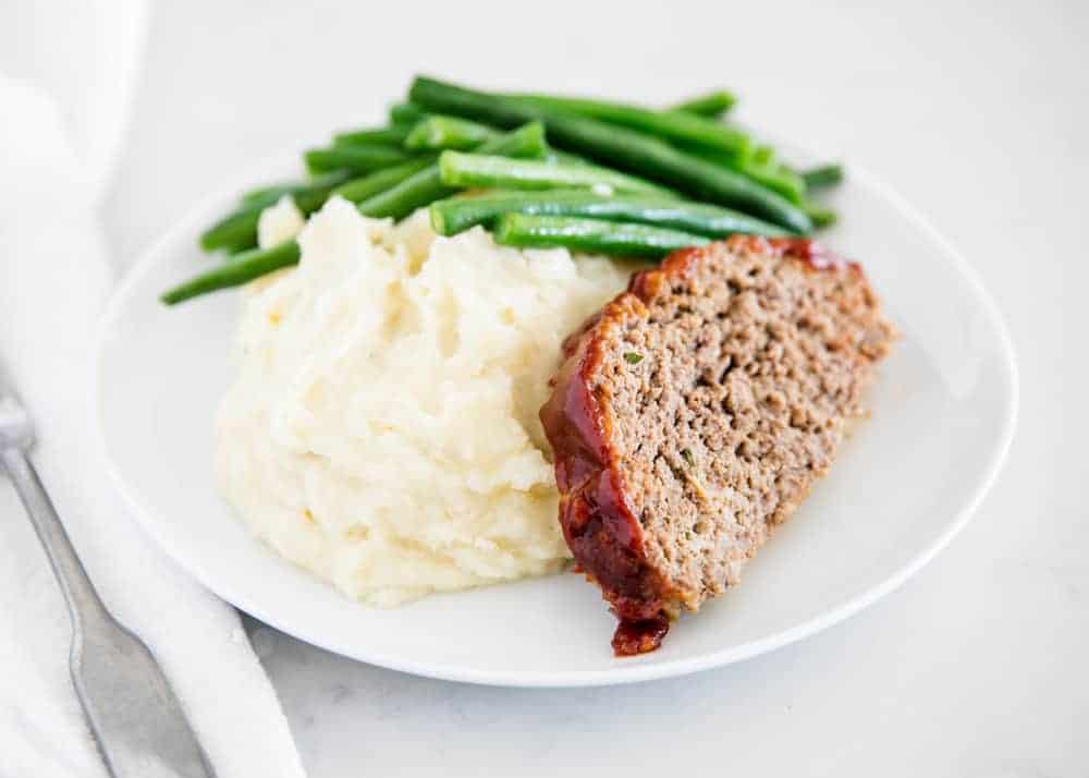 Meatloaf with mashed potatoes and green beans.