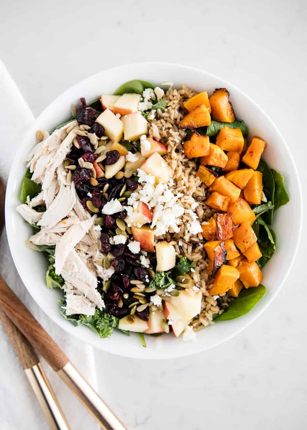 Harvest salad in a white bowl.