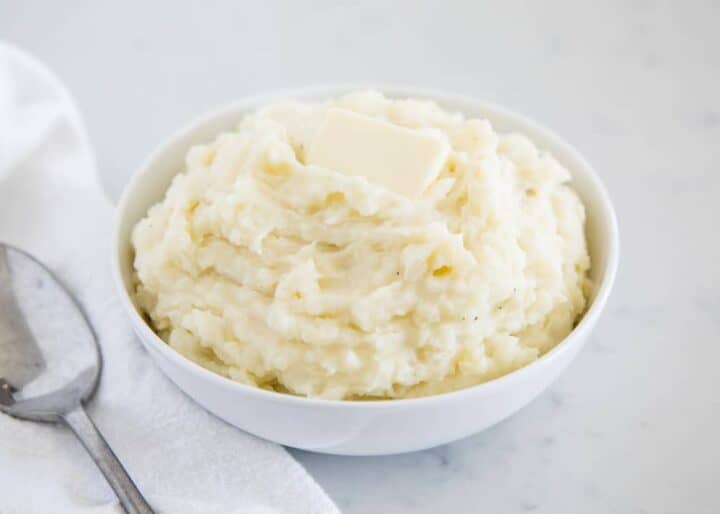 creamy mashed potatoes in a white bowl