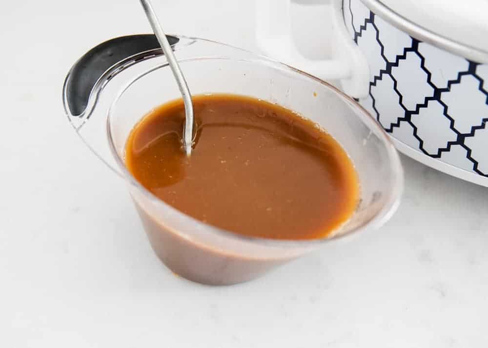 Teriyaki sauce in measuring cup.