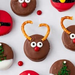 Christmas oreos on parchment paper.