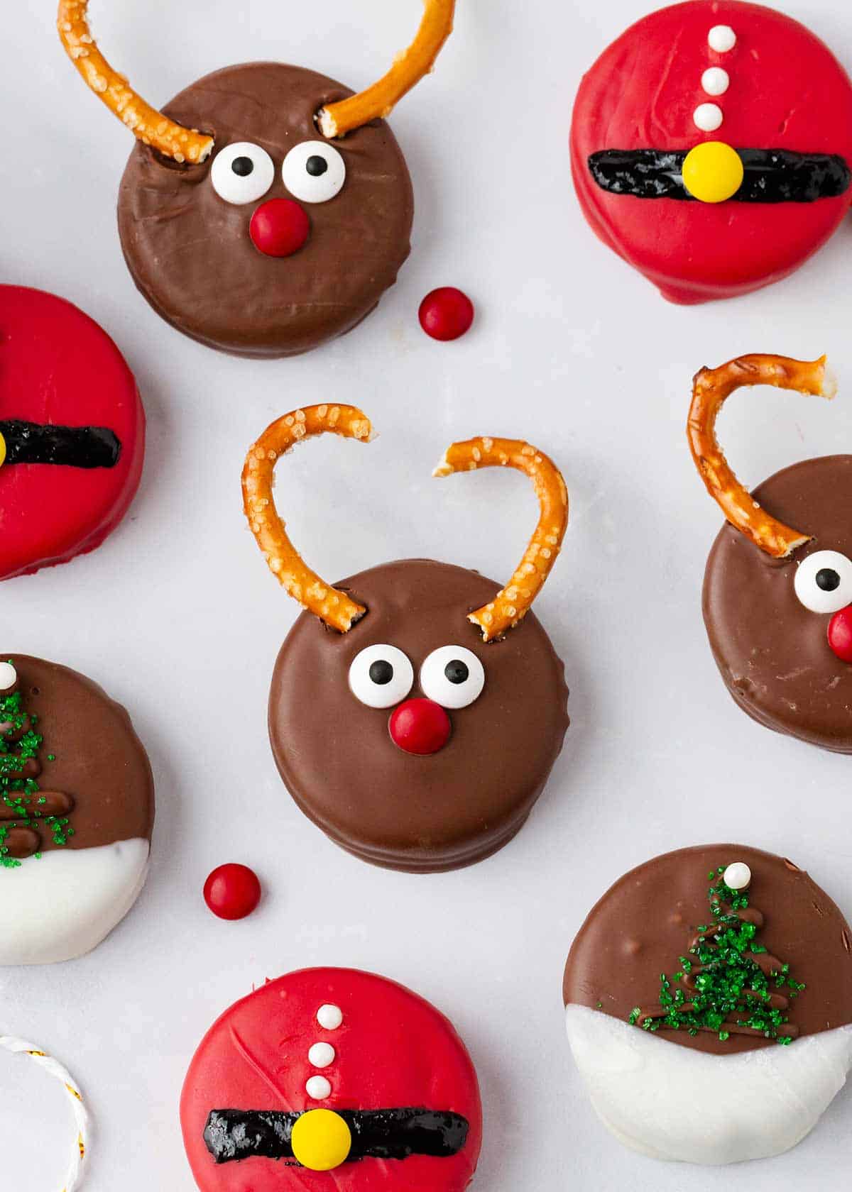 Christmas oreos on parchment paper.