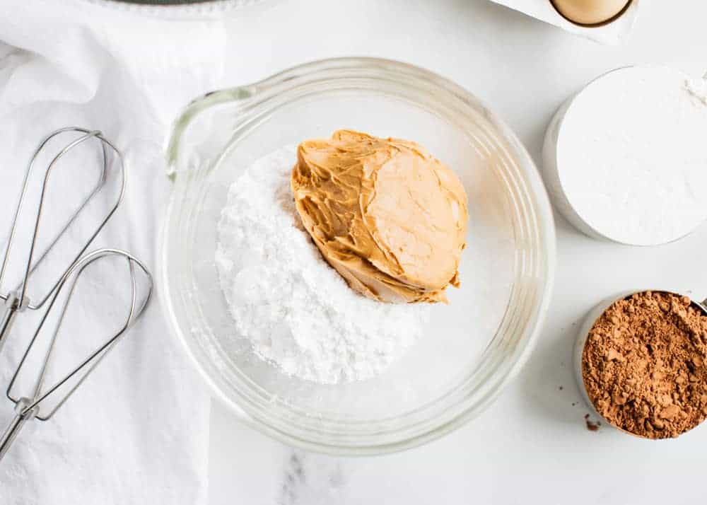 Making peanut butter filling for chocolate cookies.